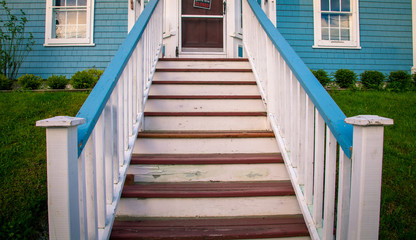 wooden steps and railing to a door