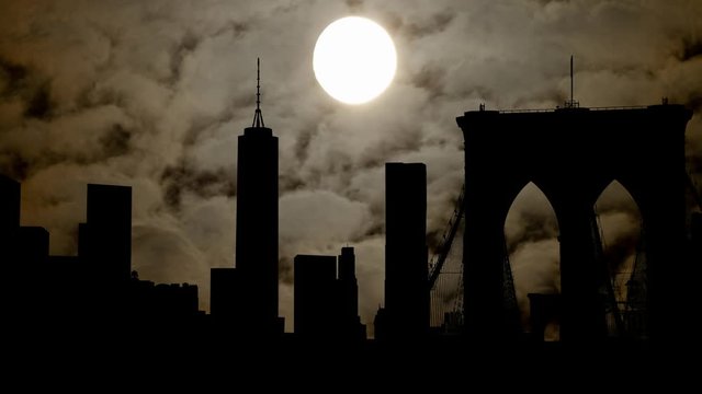 Manhattan Skyline, Time Lapse in Dark Night with Full Moon with Kennedy RFK Bridge and Skyscrapers in Silhouette, New York City, USA