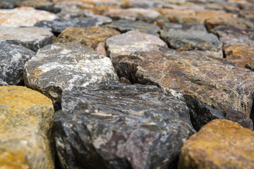Close up of rough cut stone wall, Background.