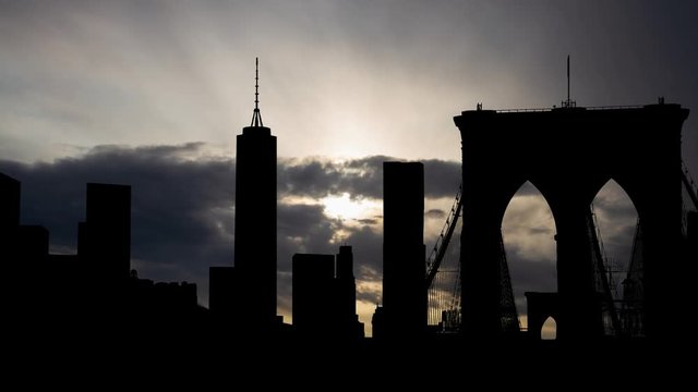 New York City: View of Dark Manhattan Skyline at Sunrise from F. Kennedy RFK Bridge or Triborough bridge, USA