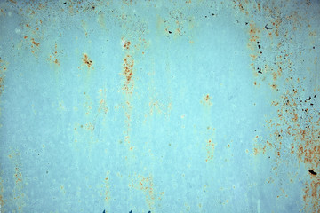 Rust metal texture with peeling paint, blue color. Textural background, copy space, shot from above. text underlay.