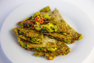 Green Quesadilla with avocado, dried tomatoes and jalapeno