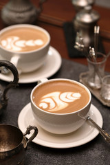 cup of coffee with milk and cookies