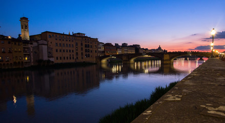 reflections of night town in river