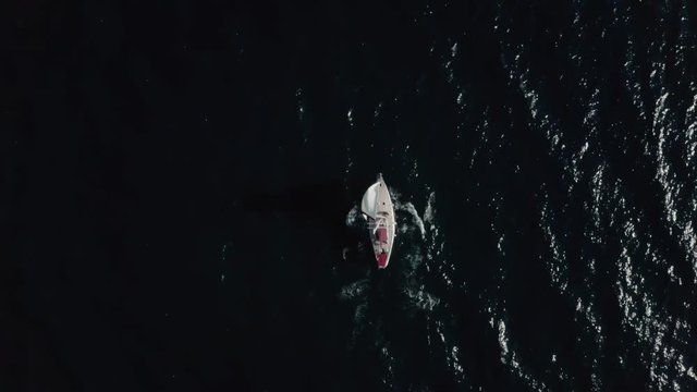 Yacht sailing on opened sea. Sailing boat. Yacht from drone. Yachting video. Yacht from above. Sailboat from drone. Sailing video. Yachting at windy day. Yacht. Sailboat.
