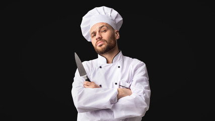 Cook Man Holding Knife Posing In Studio, Panorama
