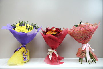 shelf with bouquets of flowers in a flower shop