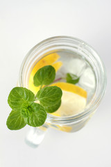 Glass of water, lemon and mint. Detox