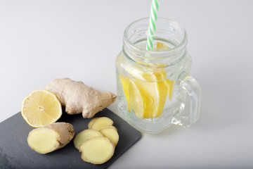 Glass of water, lemon and ginger. Detox
