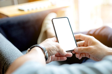 Mockup image blank white screen cell phone.woman hand holding texting using mobile on desk at coffee shop.background empty space for advertise text.people contact marketing business,technology 