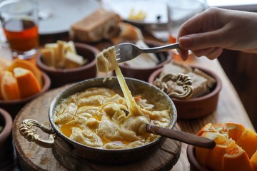 Mihlama (kuymak) is a famous traditional food from Black Sea region in Turkey. It is prepared with corn meal and cheese and served hot.