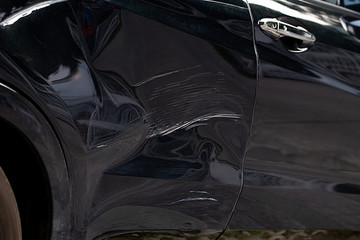 Side of black car damage or Scratched on black background