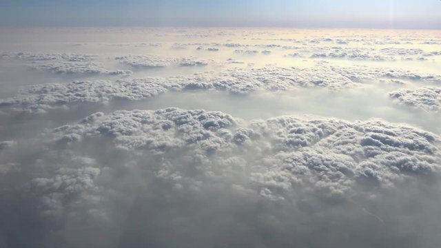 Flying above the clouds. View from the airplane.