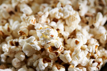 Popcorn on black background, close up 