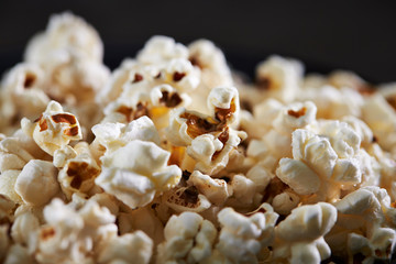 Popcorn on black background, close up 