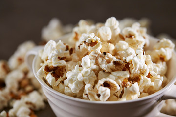 Popcorn in cup on black background 