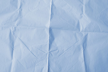 Creative background with scattered overlay of crumpled papers.