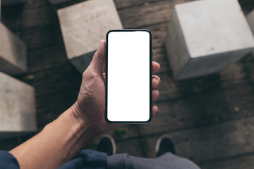 Mockup image blank white screen cell phone.woman hand holding texting using mobile on desk at coffee shop.background empty space for advertise text.people contact marketing business,technology 