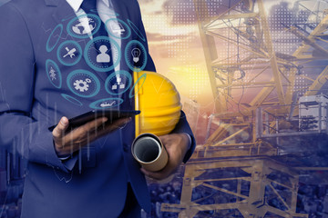 Double exposure engineering using digital technology interfaces icon with construction cranes no city background.	