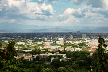 panoramic view of the city in cloudy day with mountain in the background
