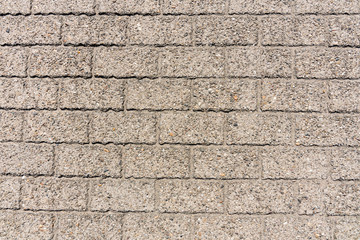 wall or floor made of grey bricks. For texture or background