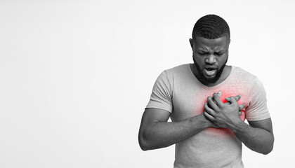 Black guy having acute pain in chest