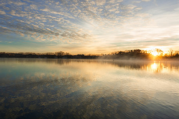 Fototapeta na wymiar Training rowing athlete at sunrise