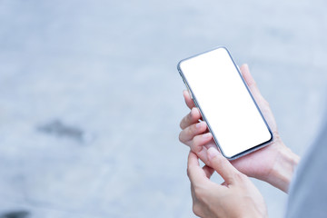 Mockup image blank white screen cell phone.woman hand holding texting using mobile.background empty space for advertise text.people contact marketing business,technology 