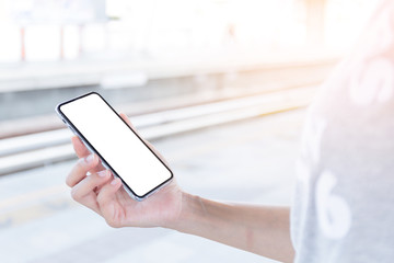 Mockup image blank white screen cell phone.woman hand holding texting using mobile.background empty space for advertise text.people contact marketing business,technology 