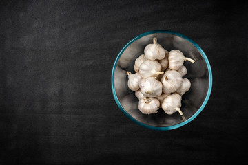 Garlic on black background.