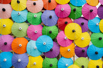 Fototapeta na wymiar Colorful of Paper Parasols, Multi-colored umbrellas background and Textures..