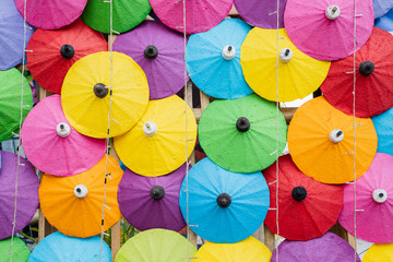Fototapeta na wymiar Colorful of Paper Parasols, Multi-colored umbrellas background and Textures..