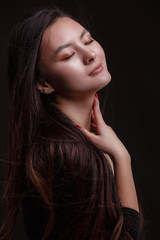 Fototapeta premium Portrait of beautiful asian woman with a black healthy hair