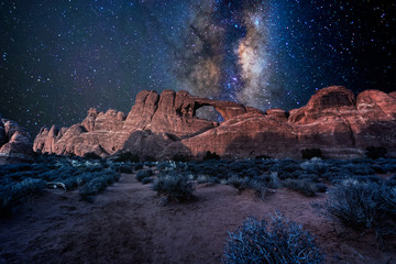 Arches National Park under a milky way star filled night sky in Moab, Utah USA.