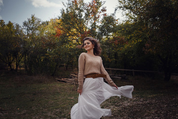 Girl resting in the village, portrait of a woman in rustic style.