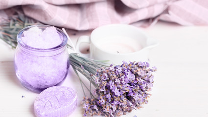 Fototapeta na wymiar Bunch of lavender flowers and cosmetics, banner, spa, beauty concept