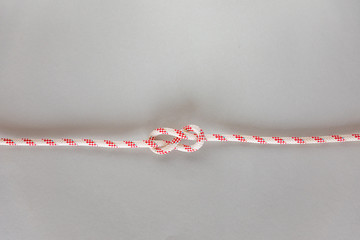 Figure eight ship knot on grey background