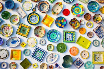 Collection of colorful Portuguese ceramic pottery, local craft products from Portugal. Ceramic...