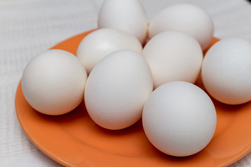 White eggs on the orange plate