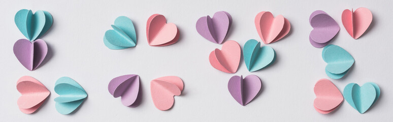 Obraz premium top view of love lettering made of colorful paper hearts on white background, panoramic shot