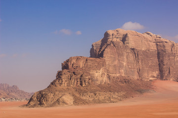 desert landscape sand valley picturesque stone mountain Wadi Rum Jordanian touristic heritage site in Middle East region travel landscape photography with empty copy space for your text here