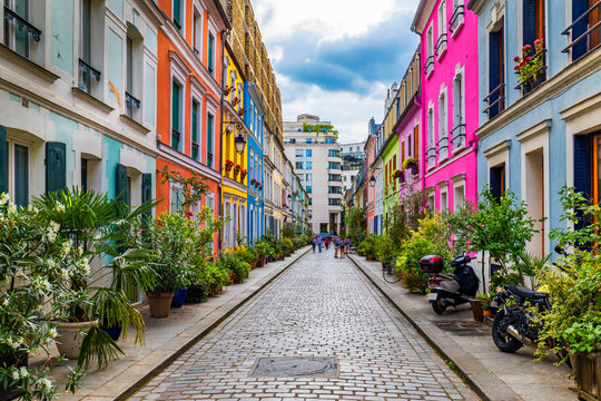 Fototapeta Cremieux Street (Rue Cremieux), Paris, France. Rue Cremieux in the 12th Arrondissement is one of the prettiest residential streets in Paris. Colored houses in Rue Cremieux street in Paris. France.
