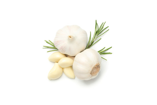 Fresh garlic bulbs, rosemary and slices isolated on white background, top view