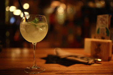 cocktail in a modern restaurant / glass with a bright cocktail in the fashionable interior serving in the restaurant, nightclub