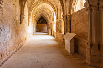 Fototapeta na wymiar View of a side of the lower cloister of the Cistercian monastery, Sta Maria of Huerta, Aragon, Spain