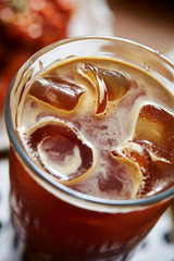 Iced coffee in glass with ice cube 