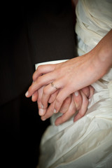 Wedding couple, bride and groom, holding hands during the ceremony