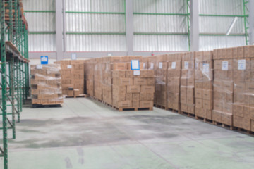 Rows of material boxes or product boxes in warehouse area.(Blur picture)