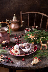 Various Christmas cookies on a wooden table