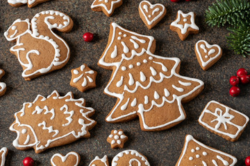 Homemade Christmas gingerbread cookies with holly berries